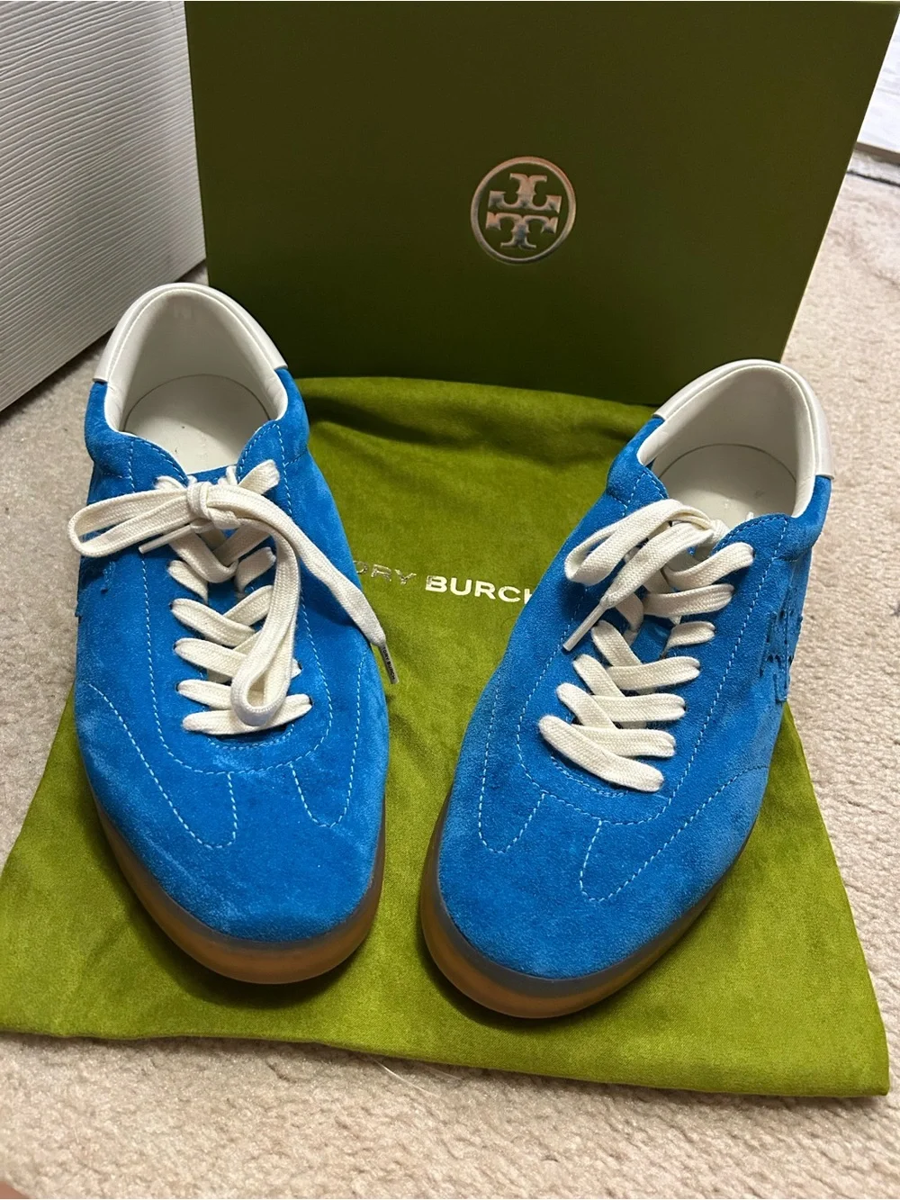 TORY BURCH phoenix suede sneakers in bright blue.
